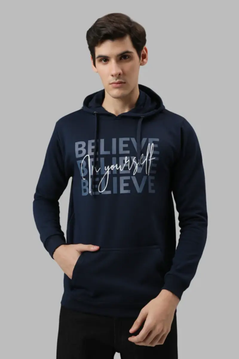 male wearing blue hoodie printing on front with grey background