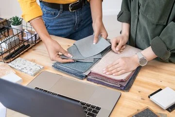 Two Females doing fabric Selection for approval